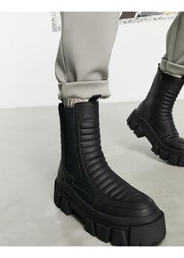 ASOS DESIGN chelsea calf boots on chunky sole in black faux leather with padded detail