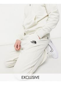 The North Face Oversized Essential joggers in cream Exclusive at ASOS-White