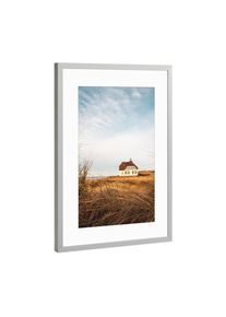 Poster with silver metal frame "Country House at North Sea" artboxONE Framed Poster