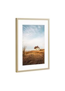 Poster with gold metal frame "Country House at North Sea" artboxONE Framed Poster