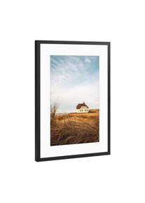 Poster with black metal frame "Country House at North Sea" artboxONE Framed Poster