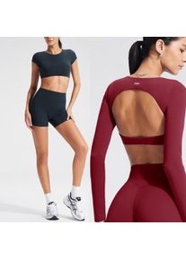 Women's long-sleeved yoga top with built-in breast pads, breathable and comfortable, suitable for gym workouts and fitness.