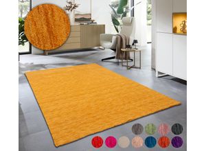 Wollteppich THEKO "Holi", gold (goldfarben), B:70cm H:13mm L:140cm, Schurwolle, Teppiche, Uni-Farben, leicht meliert, reine Wolle, handgewebt mit Knüpfoptik